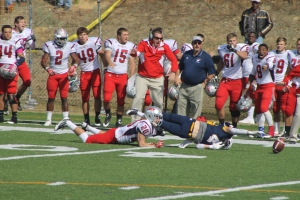 Having just dropped a pass, Reinhardt receiver Aaron Kennedy stretches after the ball as the University of the Cumberlands sideline identified the loose ball for defender Seth Brewton